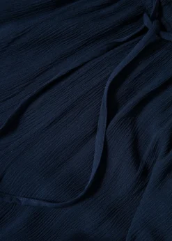 Mörkblåa vida byxor med knyt